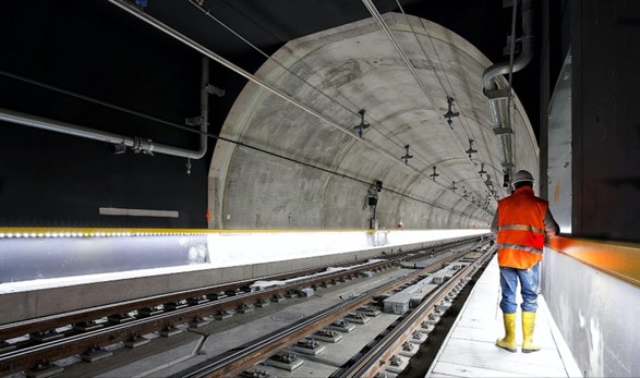 a construction worker inside a rail tunnel