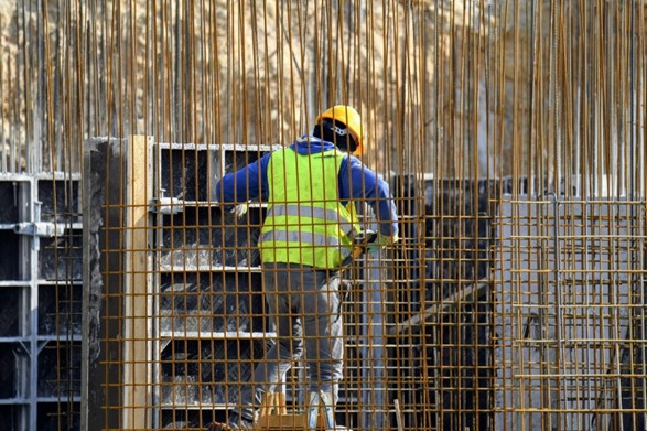 a construction worker installing rebar