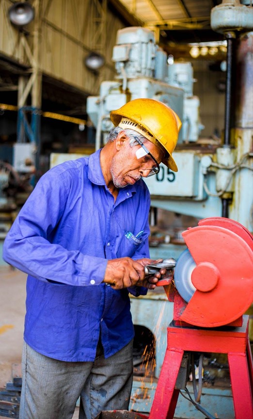 a construction worker using a grinder