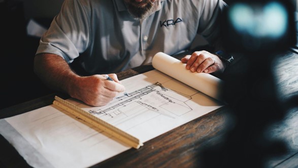 an architect examining a blueprint